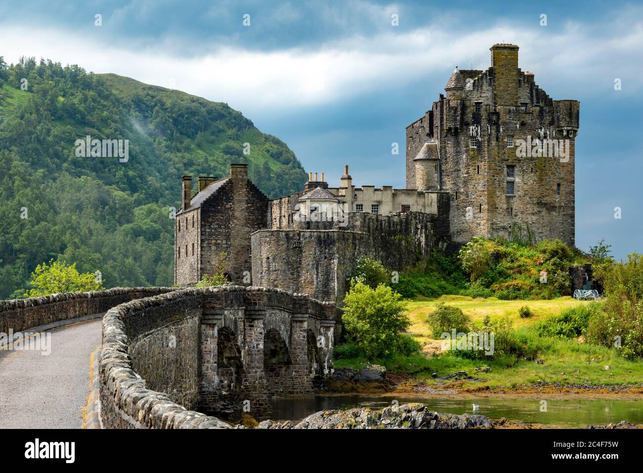 Eilean Donan Castle Loch Duich Highland Scotland Bridge To The Castle After Summer Downpour Of Rain And Thunder Mist On The Hill Stock Photo Alamy