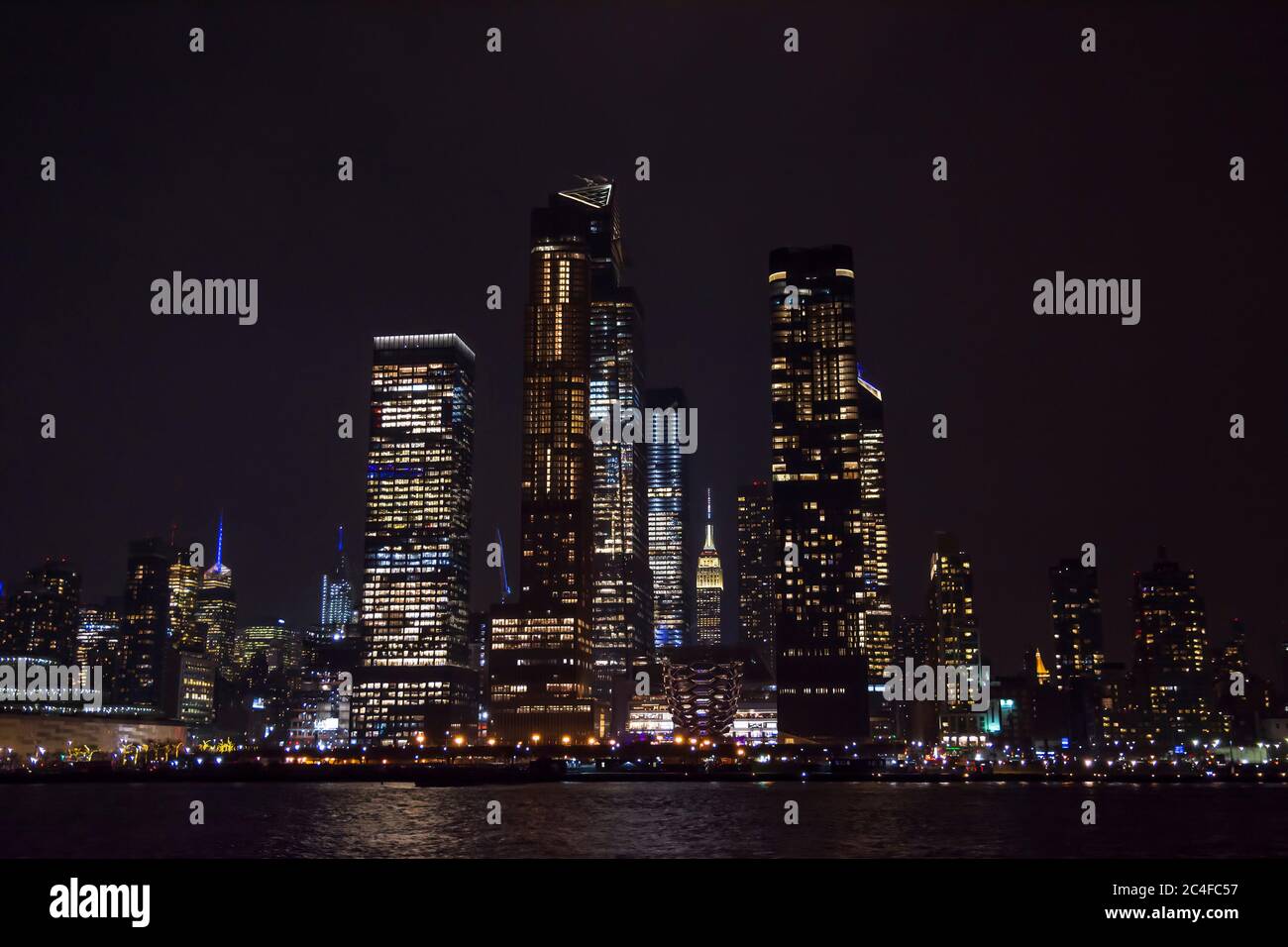 Winter cruise . New York City skyline by night. View from Hudson river ...