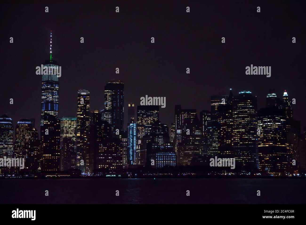 Winter cruise . New York City skyline by night. View from Hudson river ...