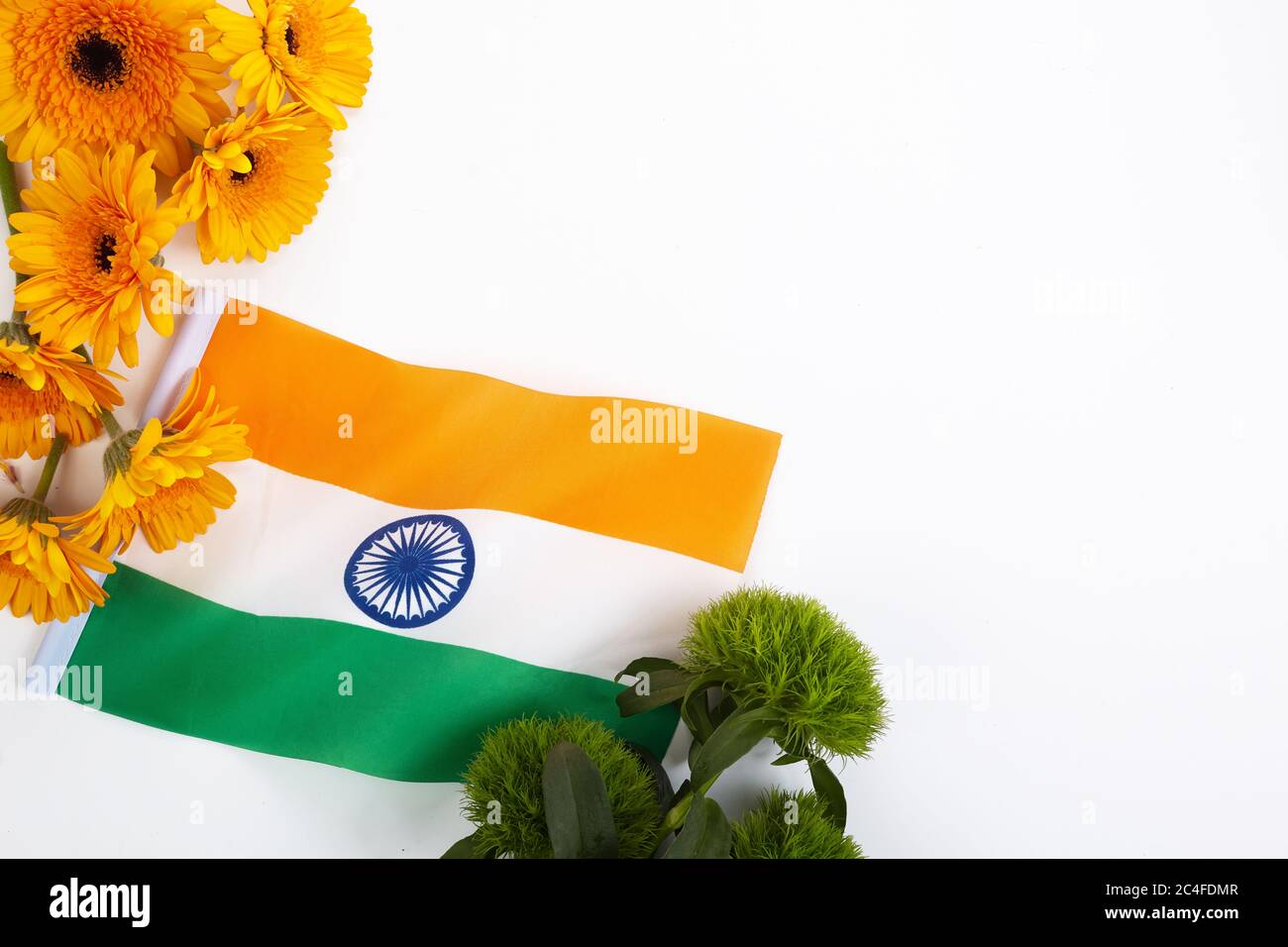 Abstract pattern with orange and green flowers frame on white background.  India independence day background Stock Photo - Alamy
