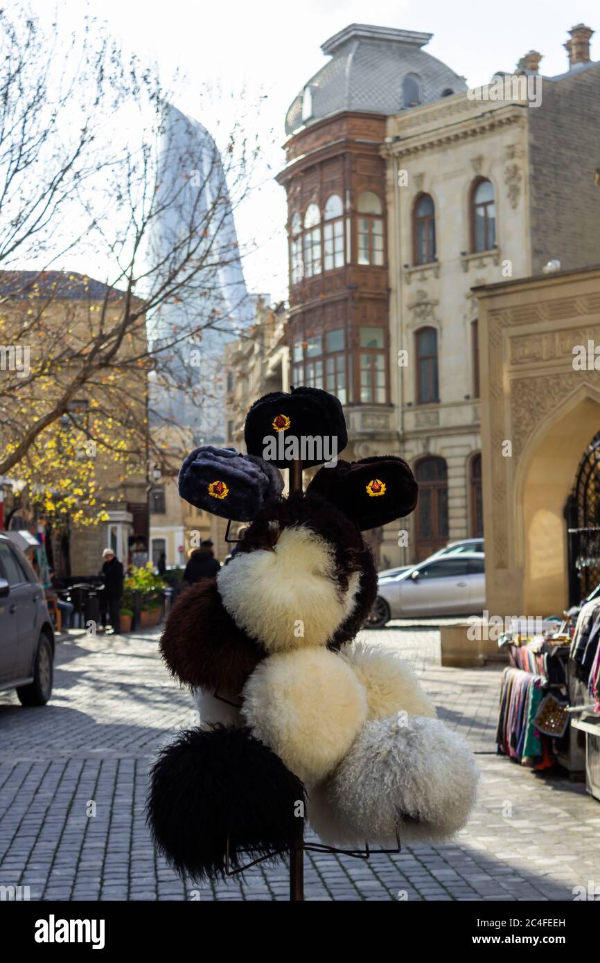 Hats of different nations and nationalities of all time are for sale in the old city Stock Photo