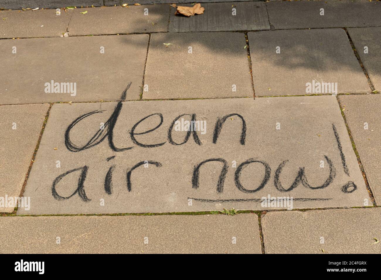 Clean Air now!  written on the pavement in the City of Bristol, England, UK Stock Photo