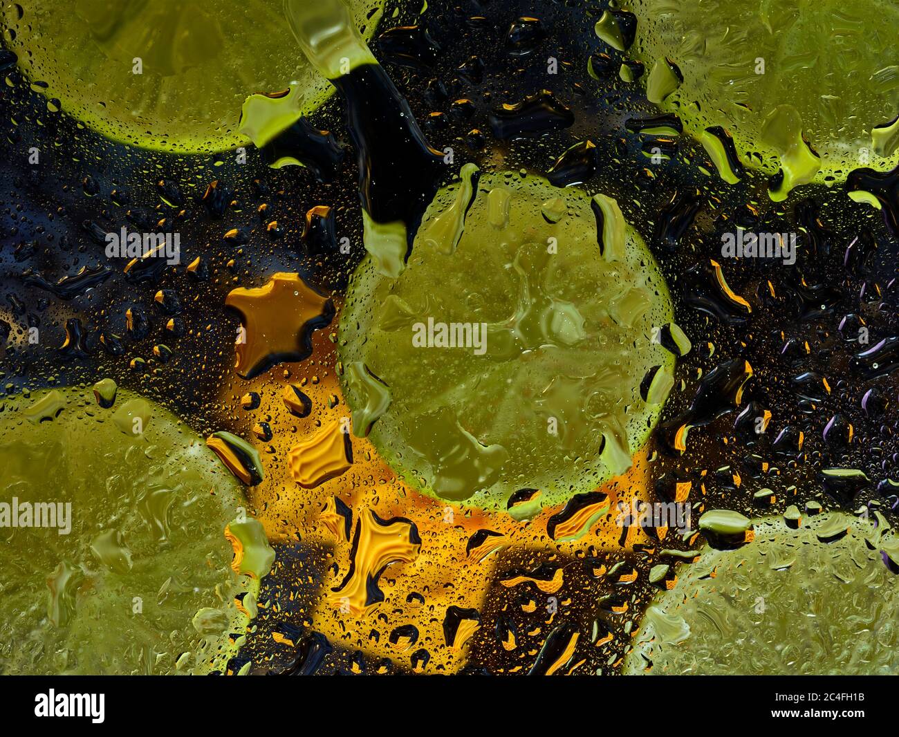 Sliced lime patterns and water droplets on a hard surface Stock Photo ...