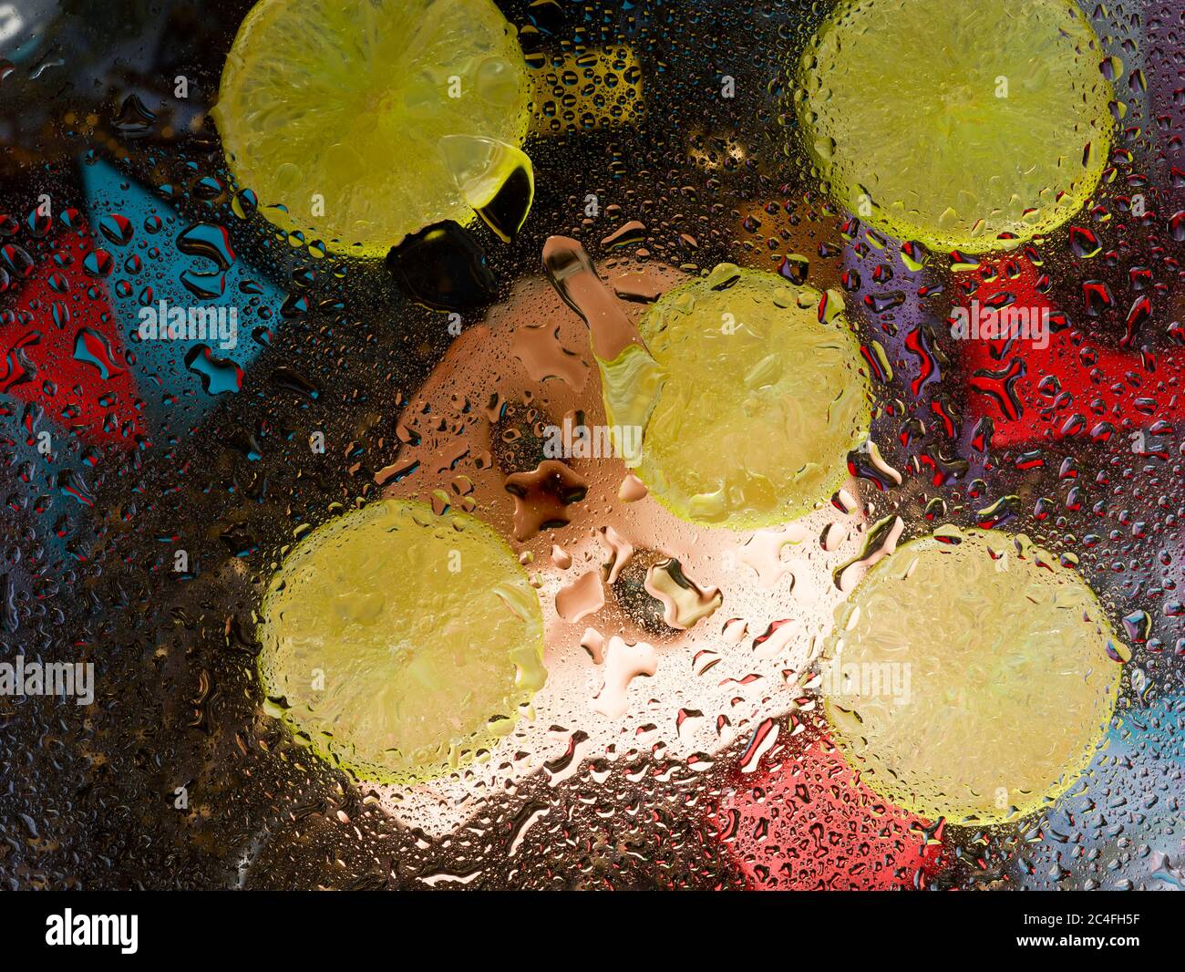 Sliced lime patterns and water droplets on a hard surface Stock Photo ...