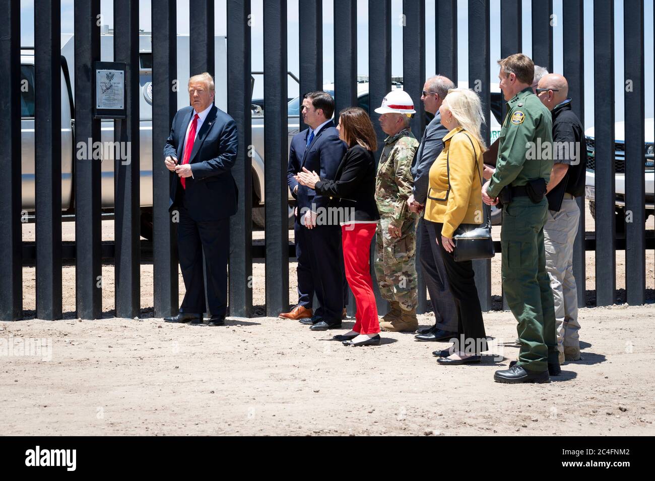 U.S. President Donald Trump along with Acting DHS Secretary Chad Wolf, Acting CBP Commissioner Mark Morgan, and Gov. Doug Ducey visit a new section of border wall along the Mexican-American border June 23, 2020 in San Luis, Arizona. The visit marked the completion of 200 miles of border wall, the majority of which is replacement for existing structure at a cost of $20-million dollars a mile. Stock Photo