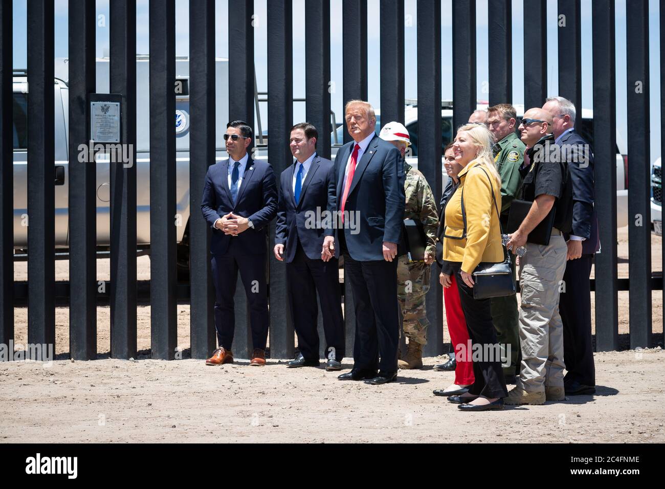 U.S. President Donald Trump along with Acting DHS Secretary Chad Wolf, Acting CBP Commissioner Mark Morgan, and Gov. Doug Ducey visit a new section of border wall along the Mexican-American border June 23, 2020 in San Luis, Arizona. The visit marked the completion of 200 miles of border wall, the majority of which is replacement for existing structure at a cost of $20-million dollars a mile. Stock Photo