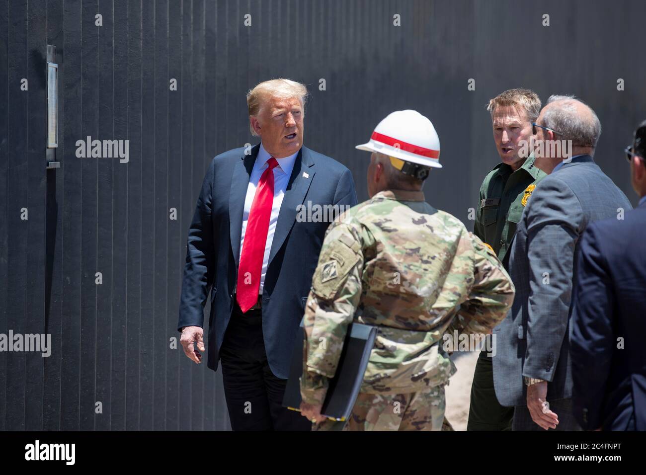 U.S. President Donald Trump is given a tour of a new section of border ...