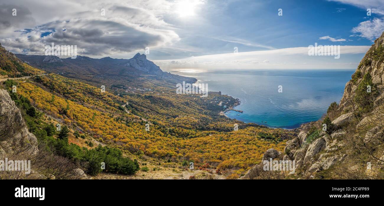 Mountain, covered with clouds against the blue sea. The picturesque bay of Laspi, Crimea seascape in autumn. seascape coast, panoramic view, Laspinsky Stock Photo