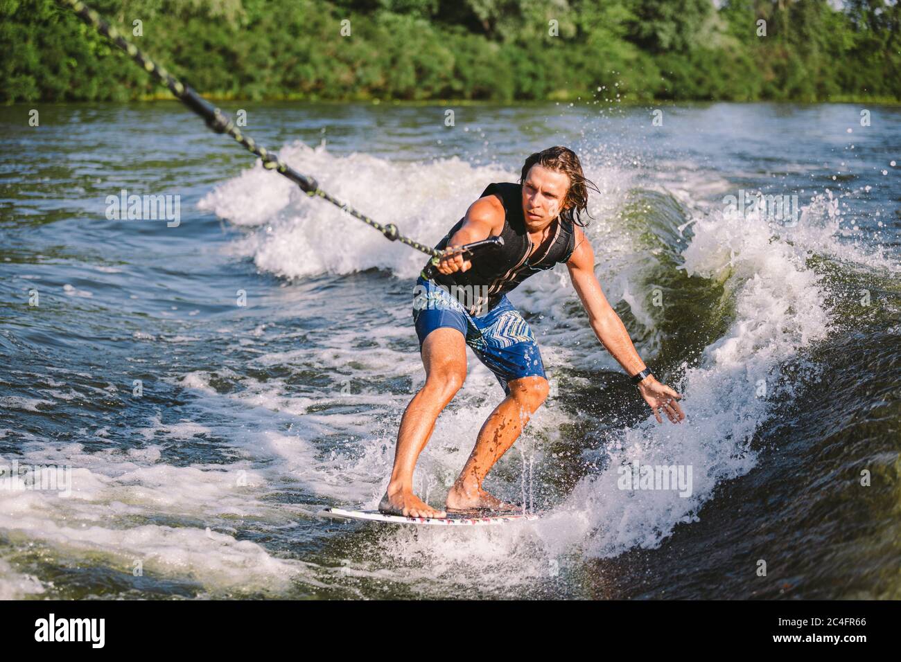 ijs een miljard backup A man is surfing on a surfboard drawn by a motor boat above the wave of the  boat. Weixerfer is engaged in surfing, entertainment, leisure, water Stock  Photo - Alamy