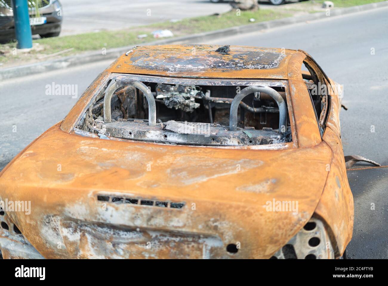 Protesters burn vehicles to block the main road on french Saint Martin. The Main protest is against the natural risk prevention plan (PPRN) decision t Stock Photo