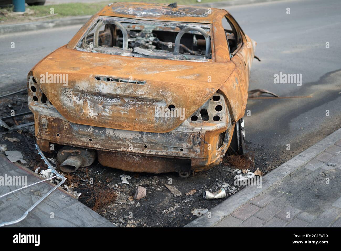Protesters burn vehicles to block the main road on french Saint Martin. The Main protest is against the natural risk prevention plan (PPRN) decision t Stock Photo