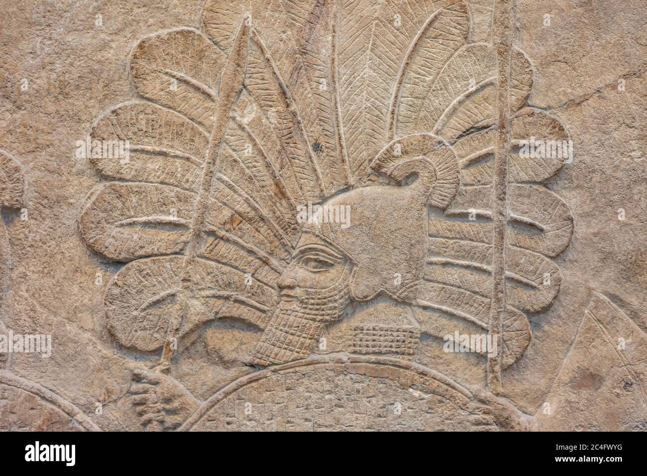 Assyrian soldier on an ancient relief in the British Museum in London England UK Stock Photo
