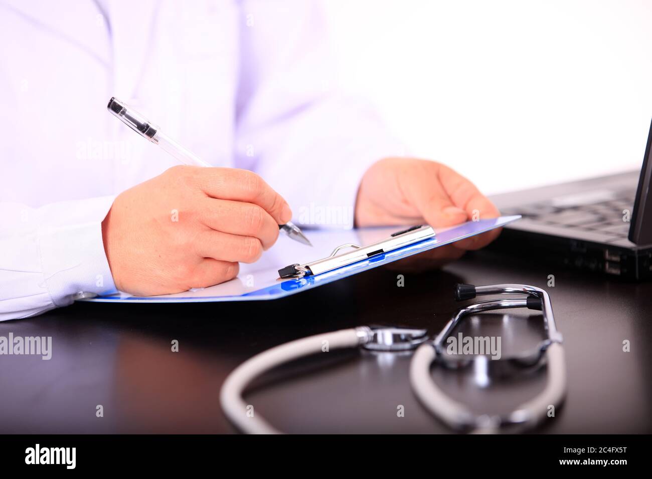 A doctor works in an office Stock Photo