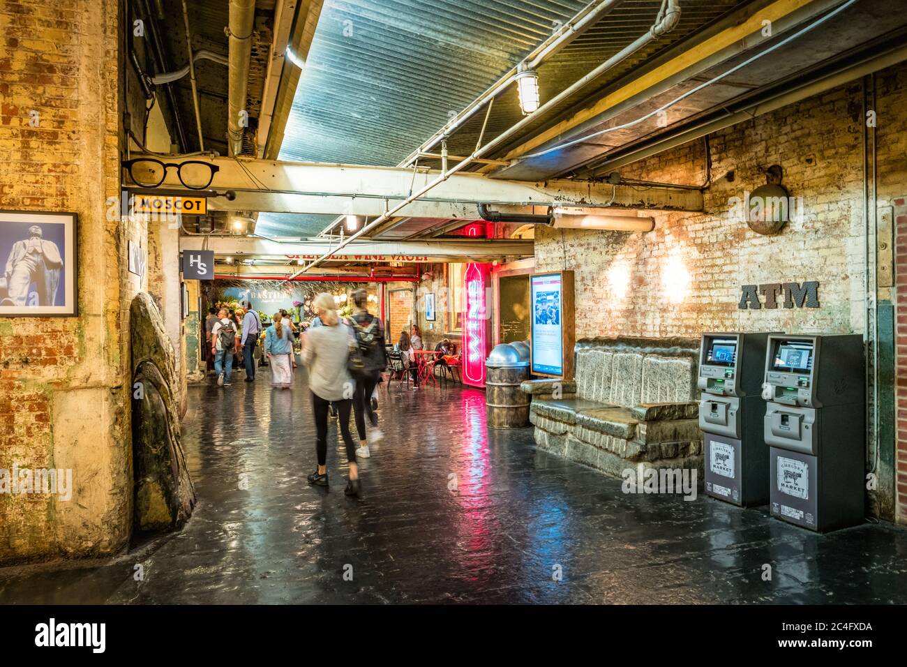 People walk in the Chelsea Market in New York City USA Stock Photo