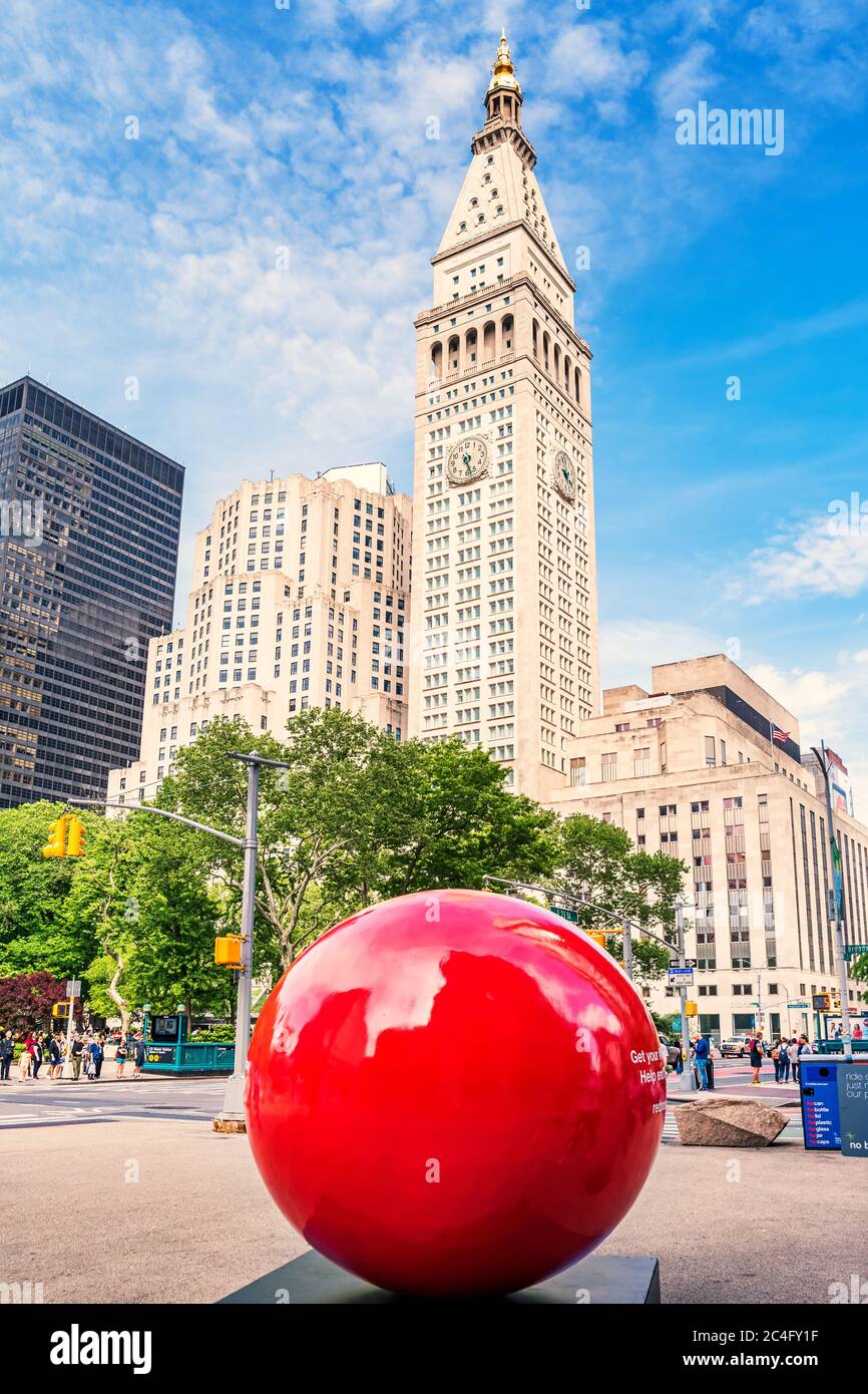 Red sphere on Flatiron Public Plaza in New York City USA during the Red nose fundraising campaign. Stock Photo