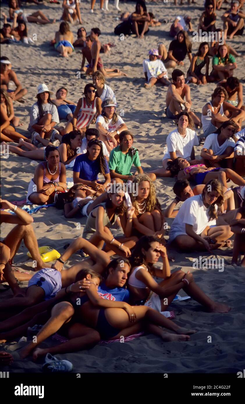 people listening to concert on beach Stock Photo