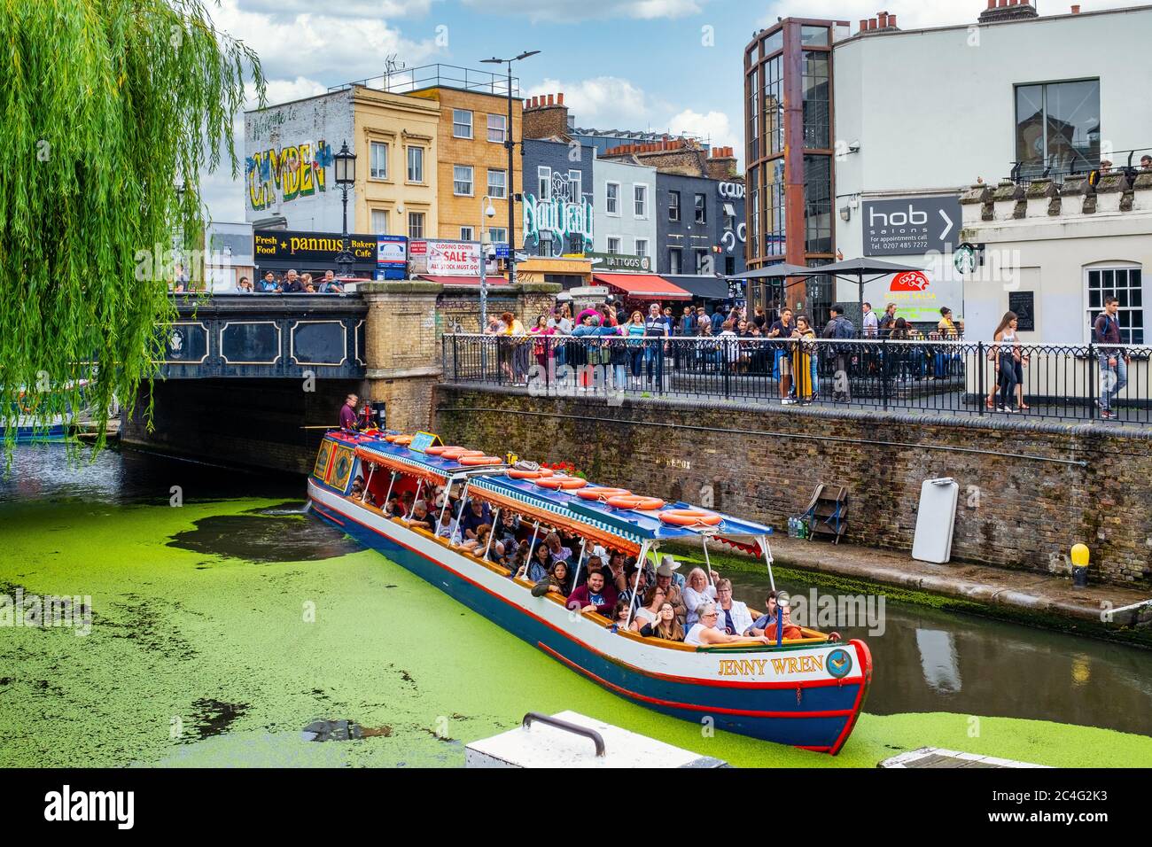 Colorful boat on the Regent's Canal in Camden Town with a view of Camden Market Stock Photo