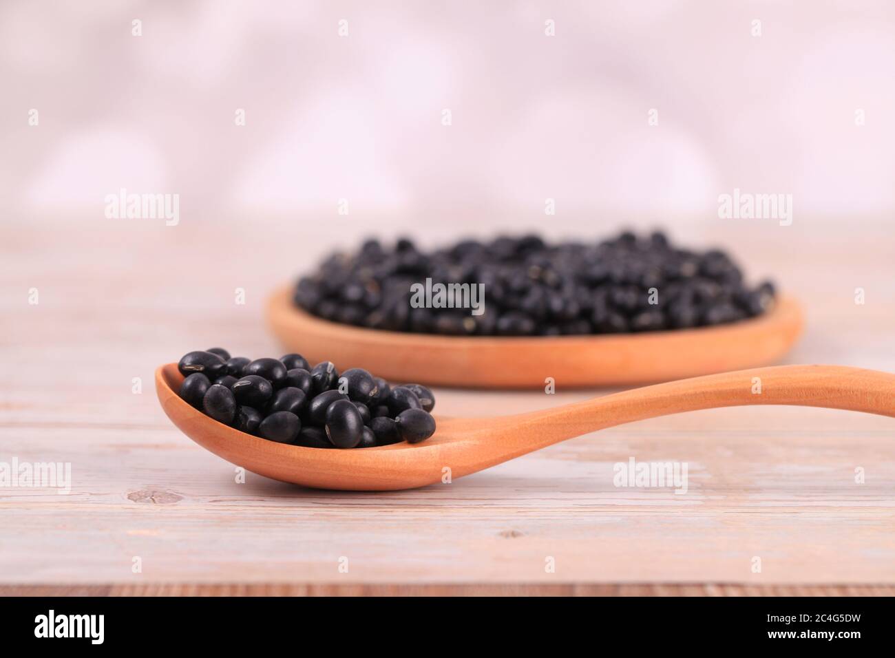 The black beans are on the wooden table Stock Photo