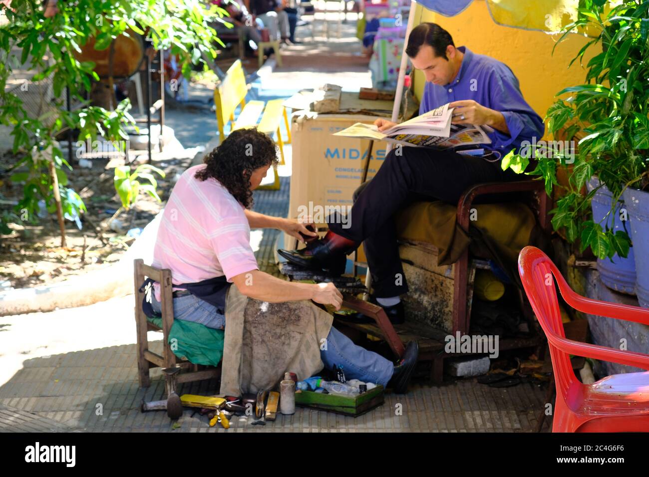 Paraguay Asuncion - Shoe cleaner on Plaza De Armas Stock Photo