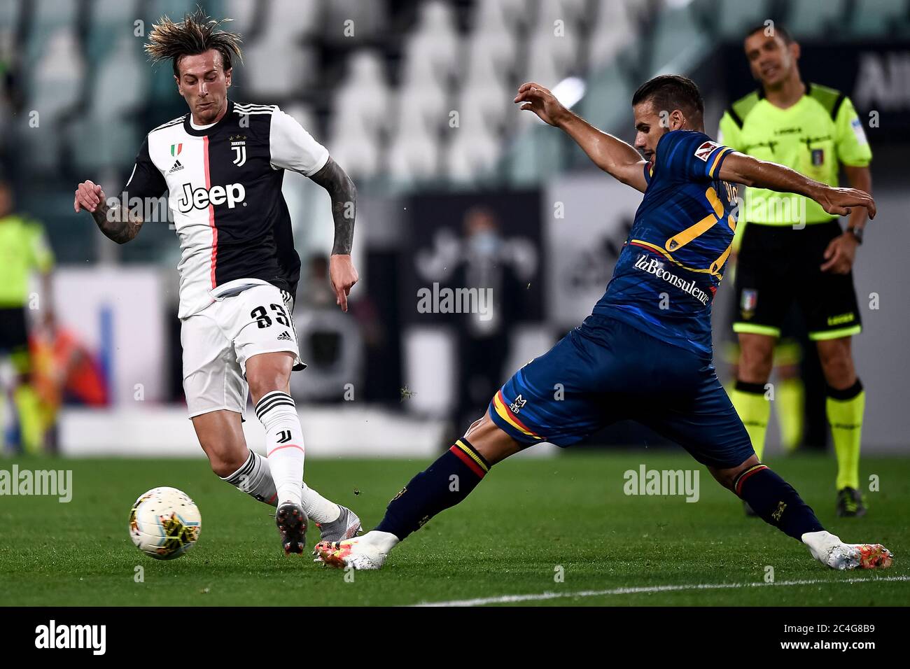 Turin, Italy. 26th June, 2020. TURIN, ITALY - June 26, 2020: Federico Bernardeschi of Juventus FC is tackled by Panagiotis Tachtsidis of US Lecce during the Serie A football match between Juventus FC and US Lecce. Juventus FC won 4-0 over US Lecce. (Photo by Nicolò Campo/Sipa USA) Credit: Sipa USA/Alamy Live News Stock Photo