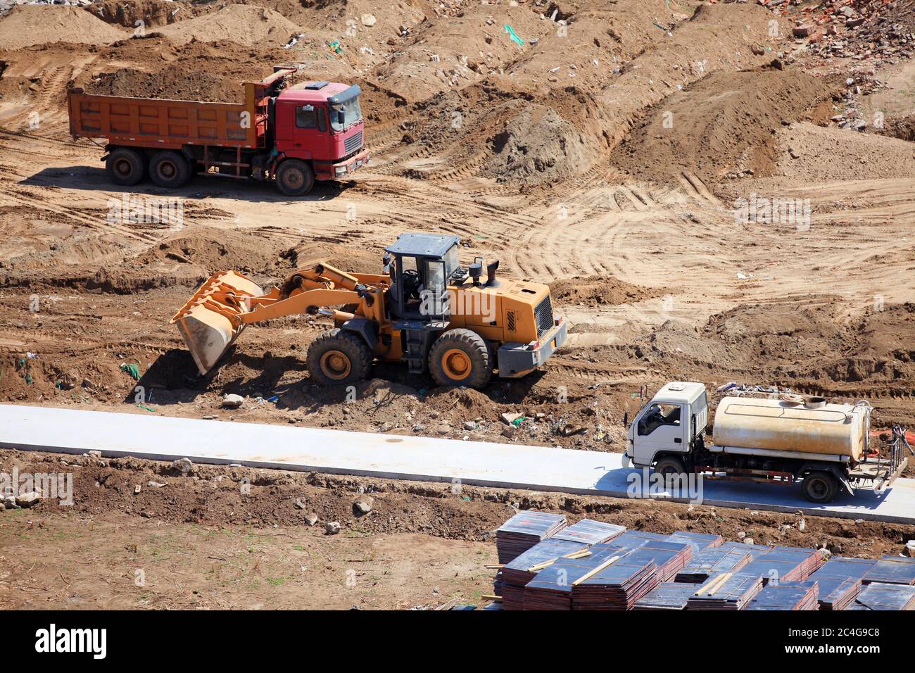 Excavator or bulldozer works on construction site Stock Photo - Alamy