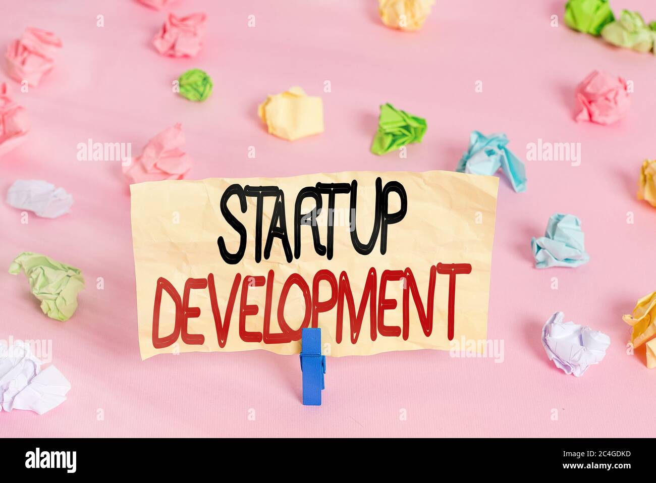 Writing note showing Startup Development. Business concept for ...