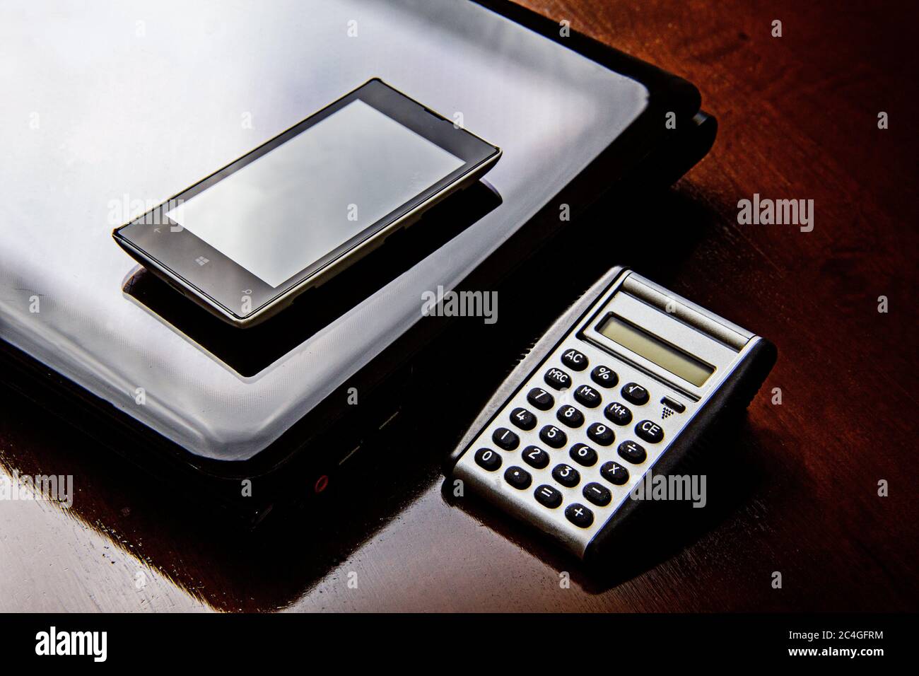 Concept of Desk Business office with pen, black folder, calculator, charts,graphs Stock Photo