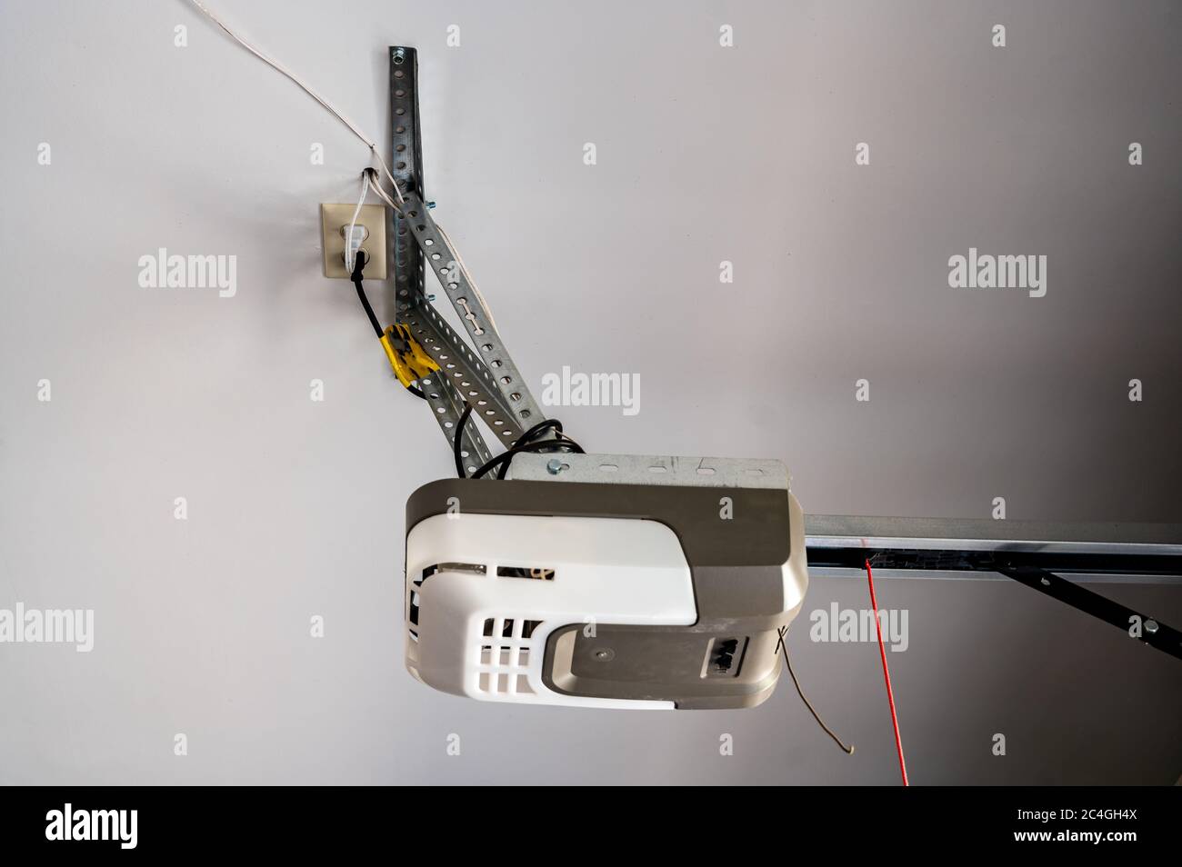 Installation or repair image of a garage door gear motor box with the chain extended Stock Photo