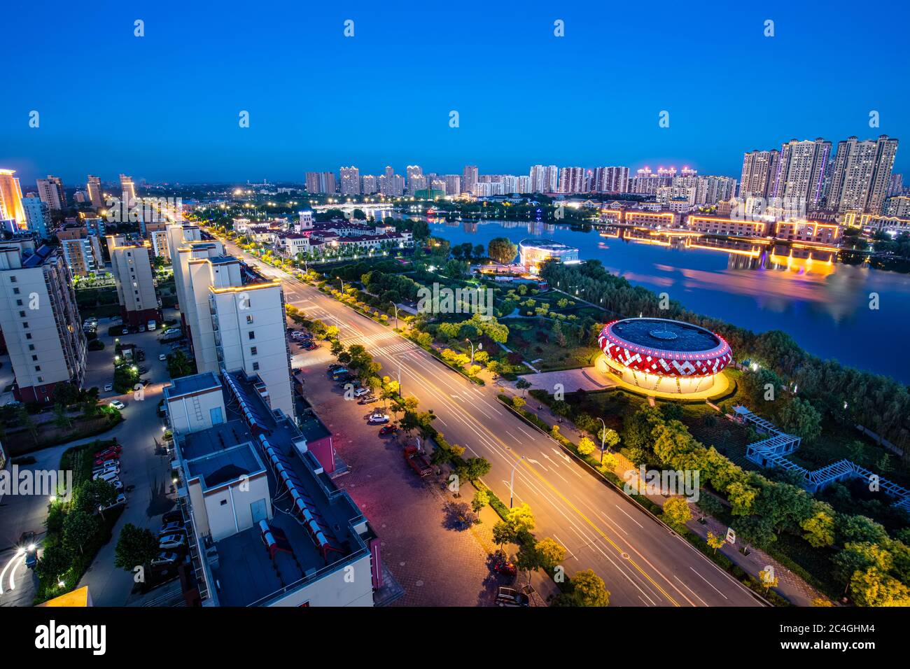 The city by the river is at night, Roads and traffic flow at night Stock Photo