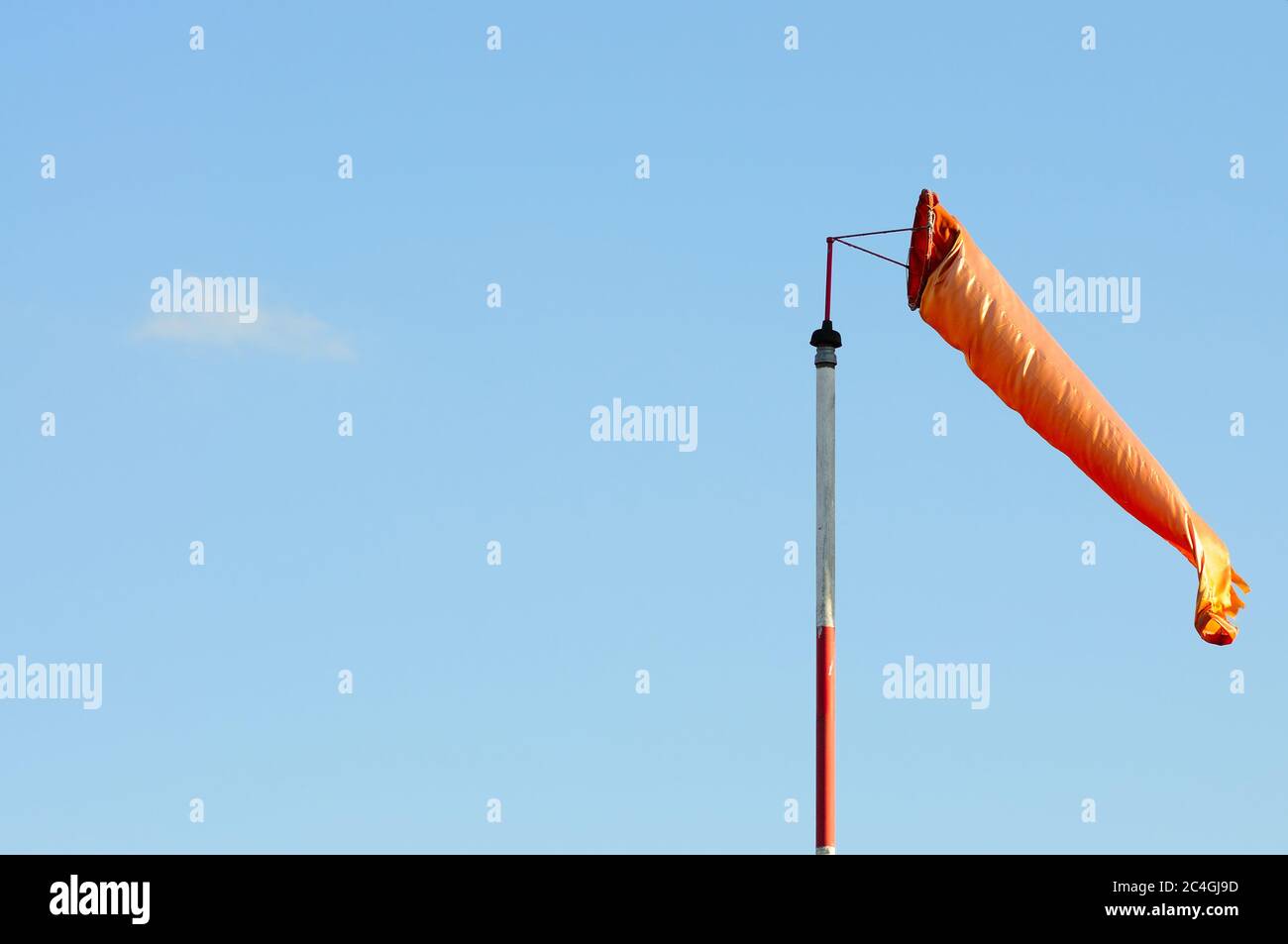 An Orange Windsock or Windvane Against the Blue Sky Stock Photo Alamy