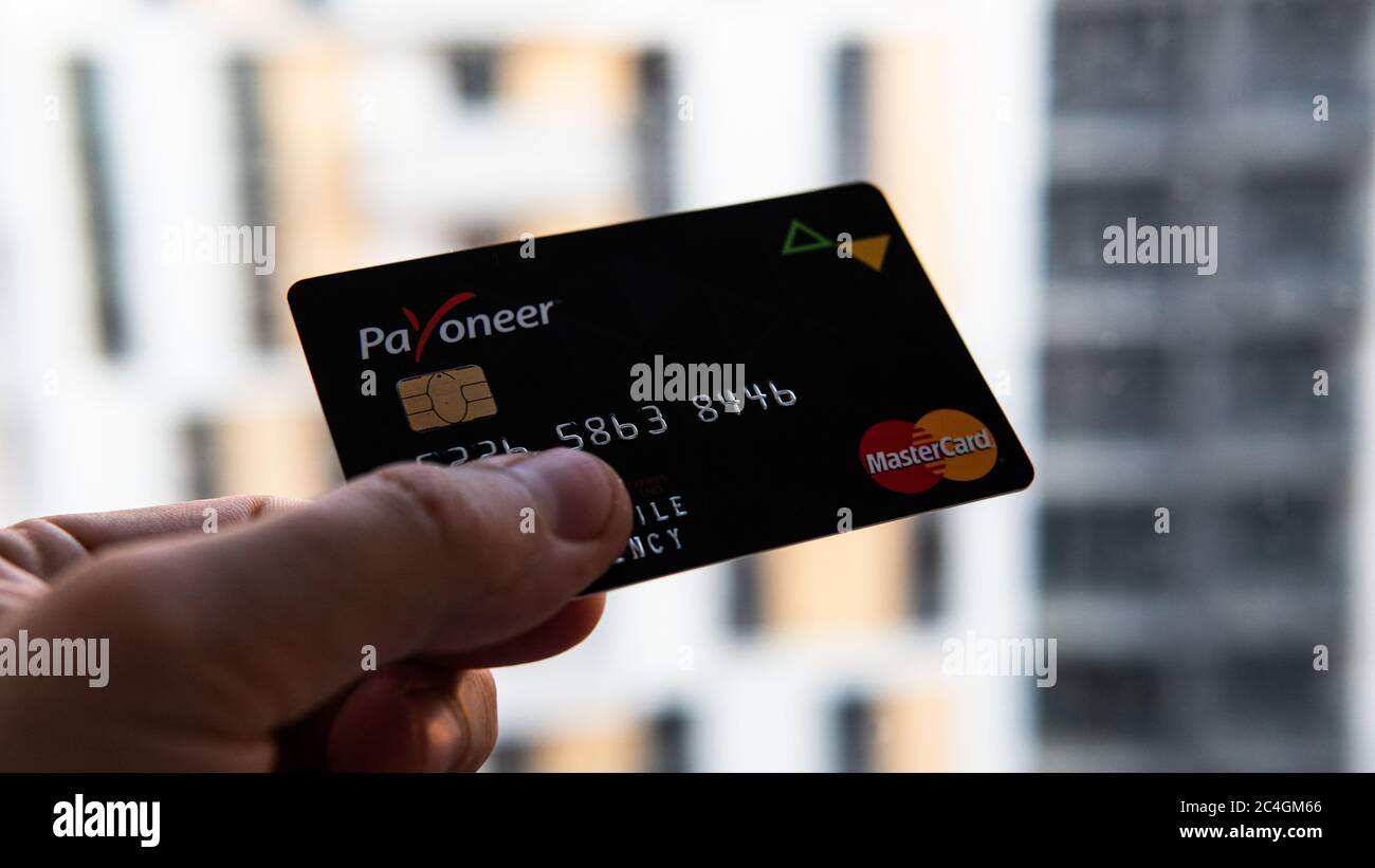 Aschheim, Germany -27 June  2020 : Blocking Payoneer cards, Wirecar company bankruptcy. Issuing Cards from Wirecard Card Solutions Stock Photo