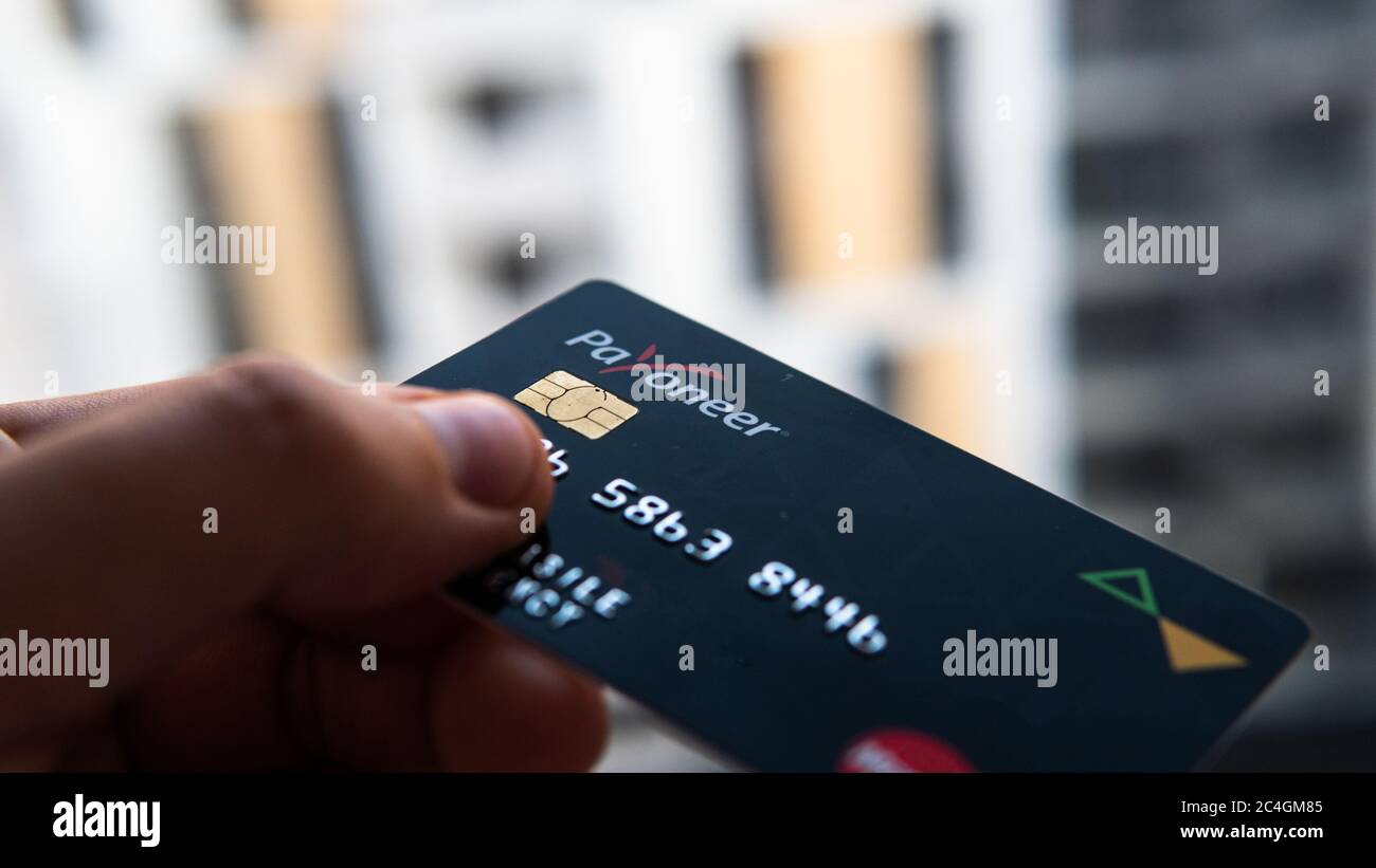 Aschheim, Germany -27 June  2020 : Blocking Payoneer cards, Wirecar company bankruptcy. Issuing Cards from Wirecard Card Solutions Stock Photo