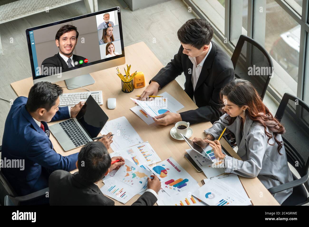 Video call group business people meeting on virtual workplace or remote  office. Telework conference call using smart video technology to  communicate c Stock Photo - Alamy