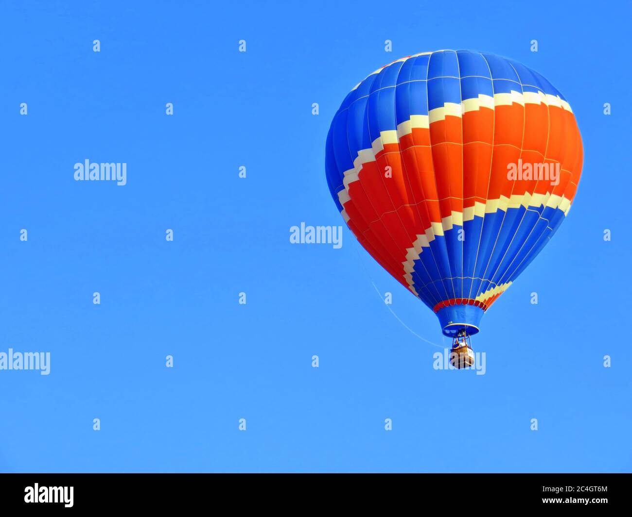 Hot air balloon in a blue sky Stock Photo - Alamy