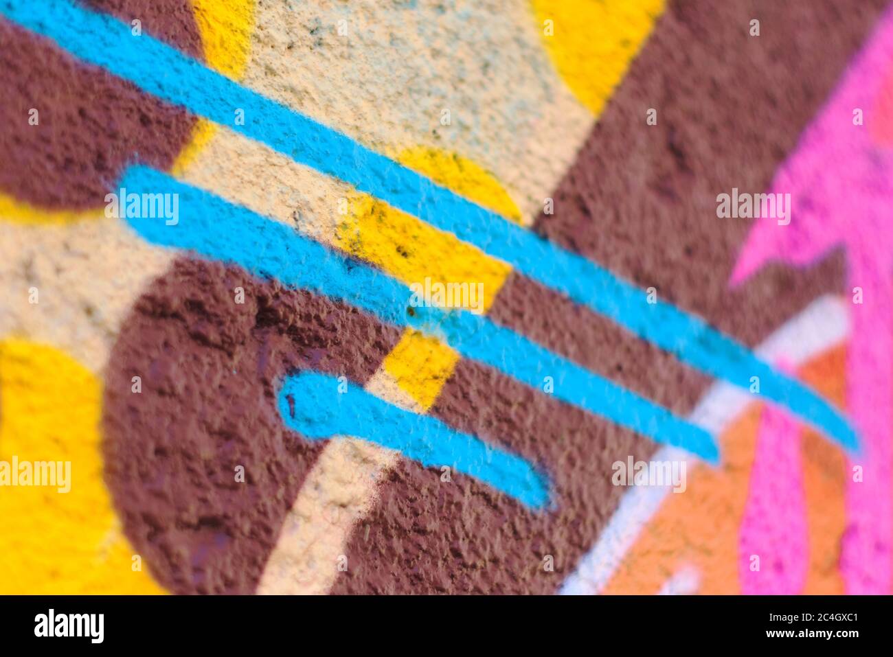 Colorful lines and shapes spray painted on a wall Stock Photo