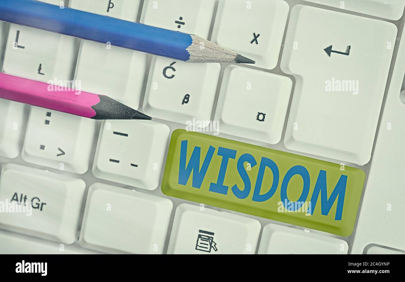 Conceptual hand writing showing Wisdom. Concept meaning body of knowledge and principles that develops within specific period White pc keyboard with e Stock Photo