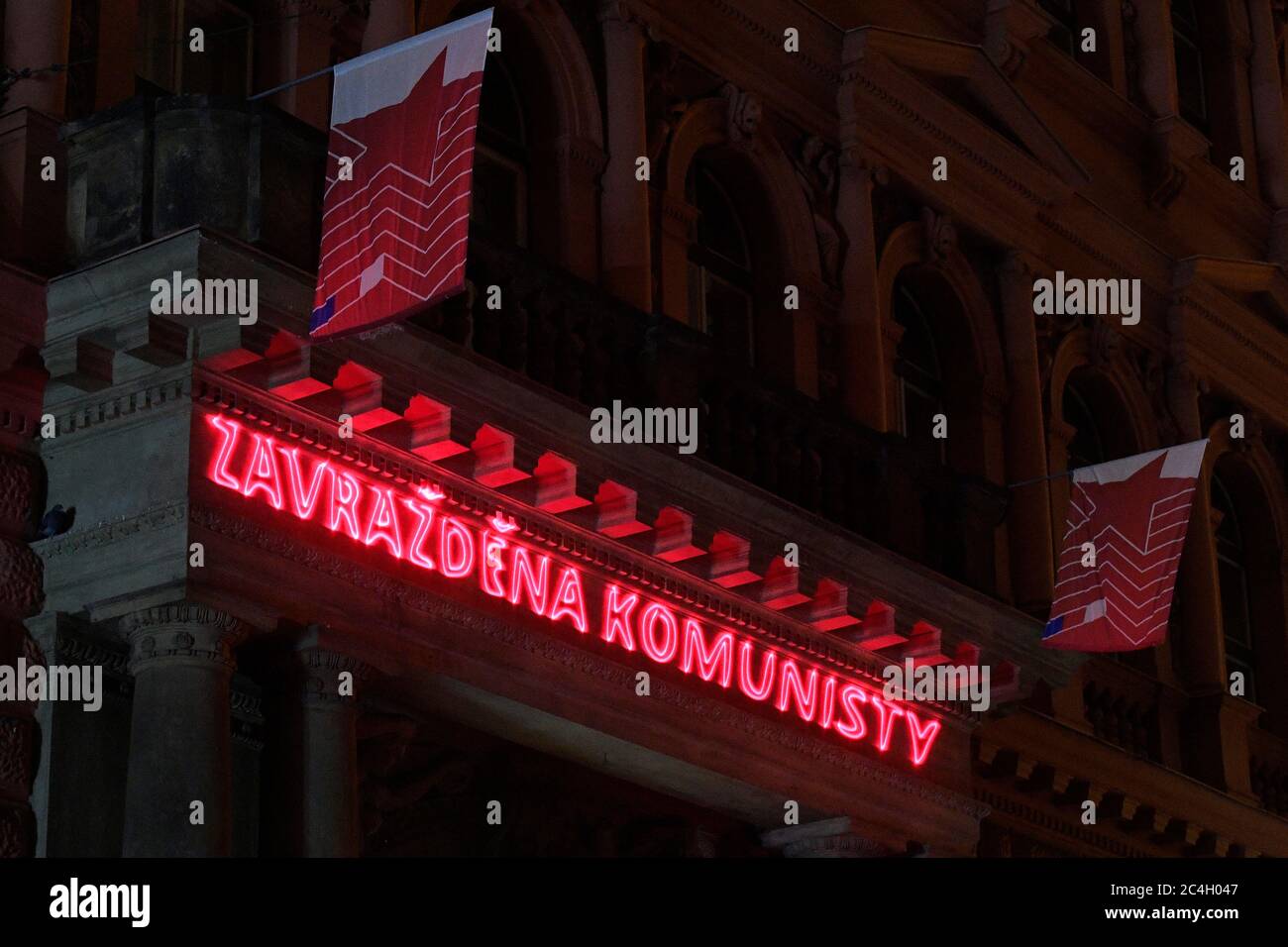 Prague, Czech Republic. 27th June, 2020. A portrait of democratic politician Milada Horakova, who was executed after a Communist show trial 70 years ago, with the inscription 'Murdered by Communists', was projected during the night on the building of the headquarters of the Communist Party (KSCM) in Prague to remember to crimes of the Czechoslovak communist regime, on June 27, 2020, in Prague, Czech Republic. Credit: Ondrej Deml/CTK Photo/Alamy Live News Stock Photo
