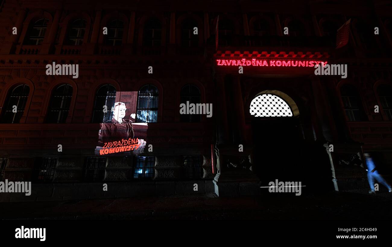 Prague, Czech Republic. 27th June, 2020. A portrait of democratic politician Milada Horakova, who was executed after a Communist show trial 70 years ago, with the inscription 'Murdered by Communists', was projected during the night on the building of the headquarters of the Communist Party (KSCM) in Prague to remember to crimes of the Czechoslovak communist regime, on June 27, 2020, in Prague, Czech Republic. Credit: Ondrej Deml/CTK Photo/Alamy Live News Stock Photo