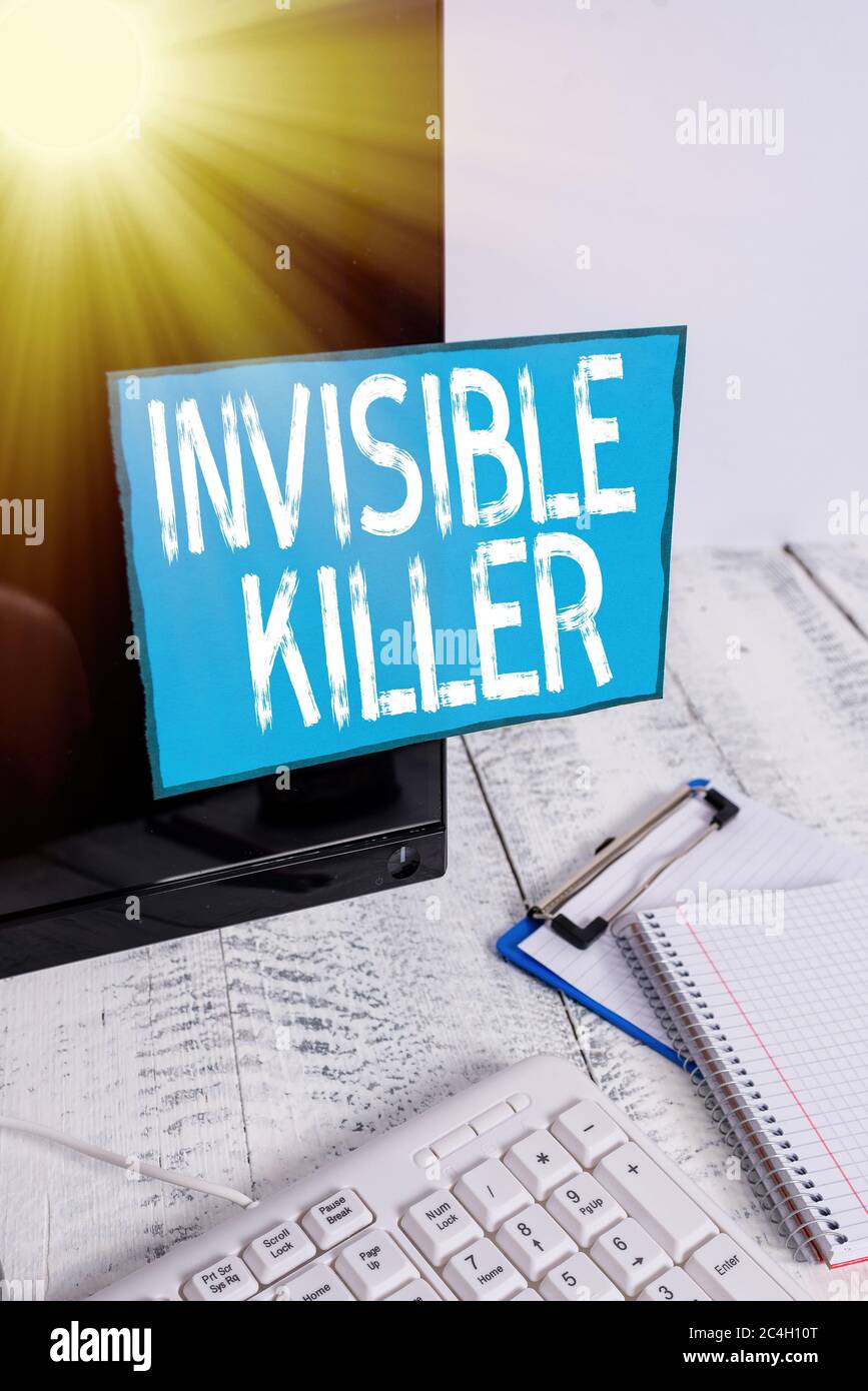 Writing note showing Invisible Killer. Business concept for presence ...