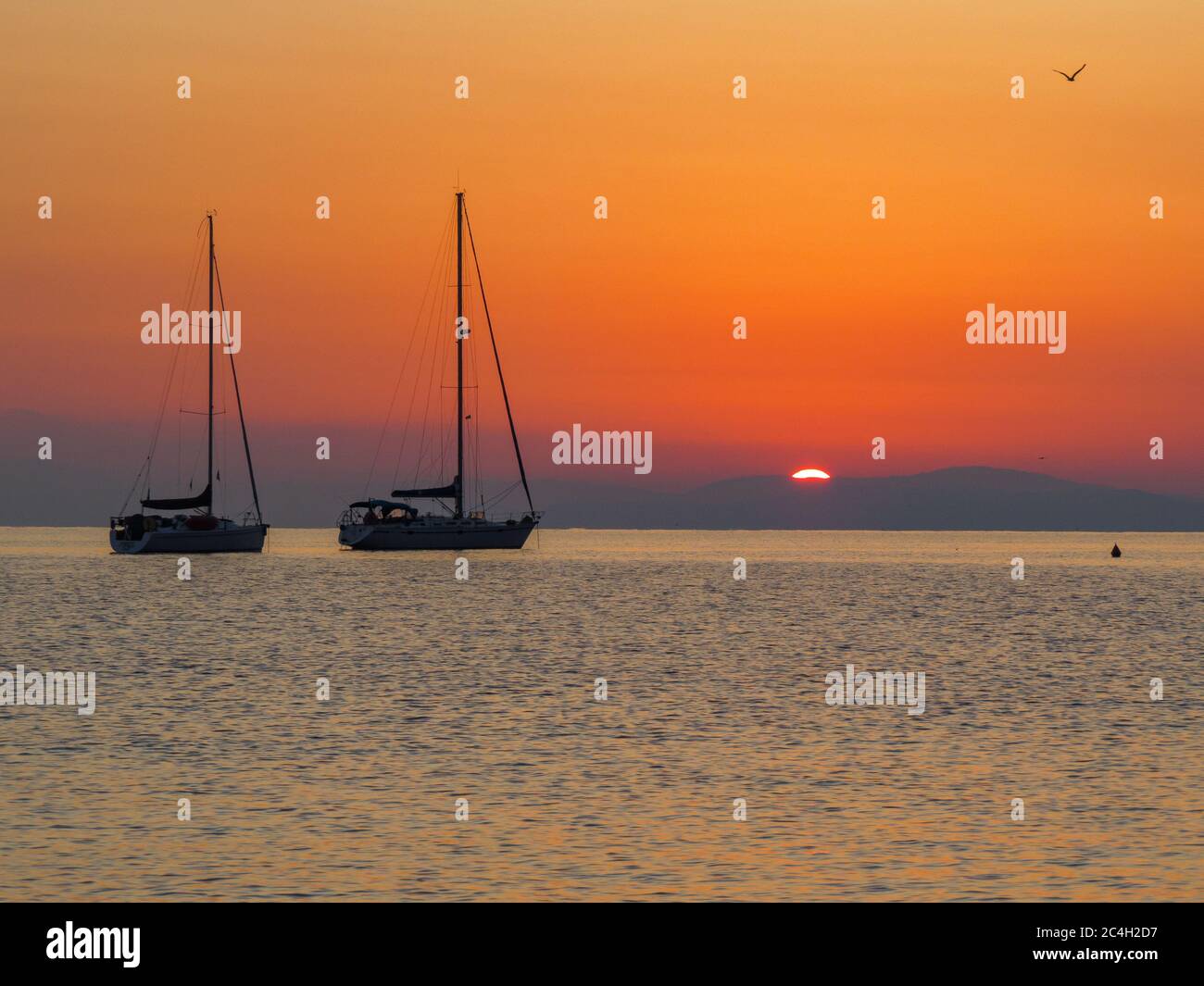 Schiffe im Sonnenaufgang Stock Photo