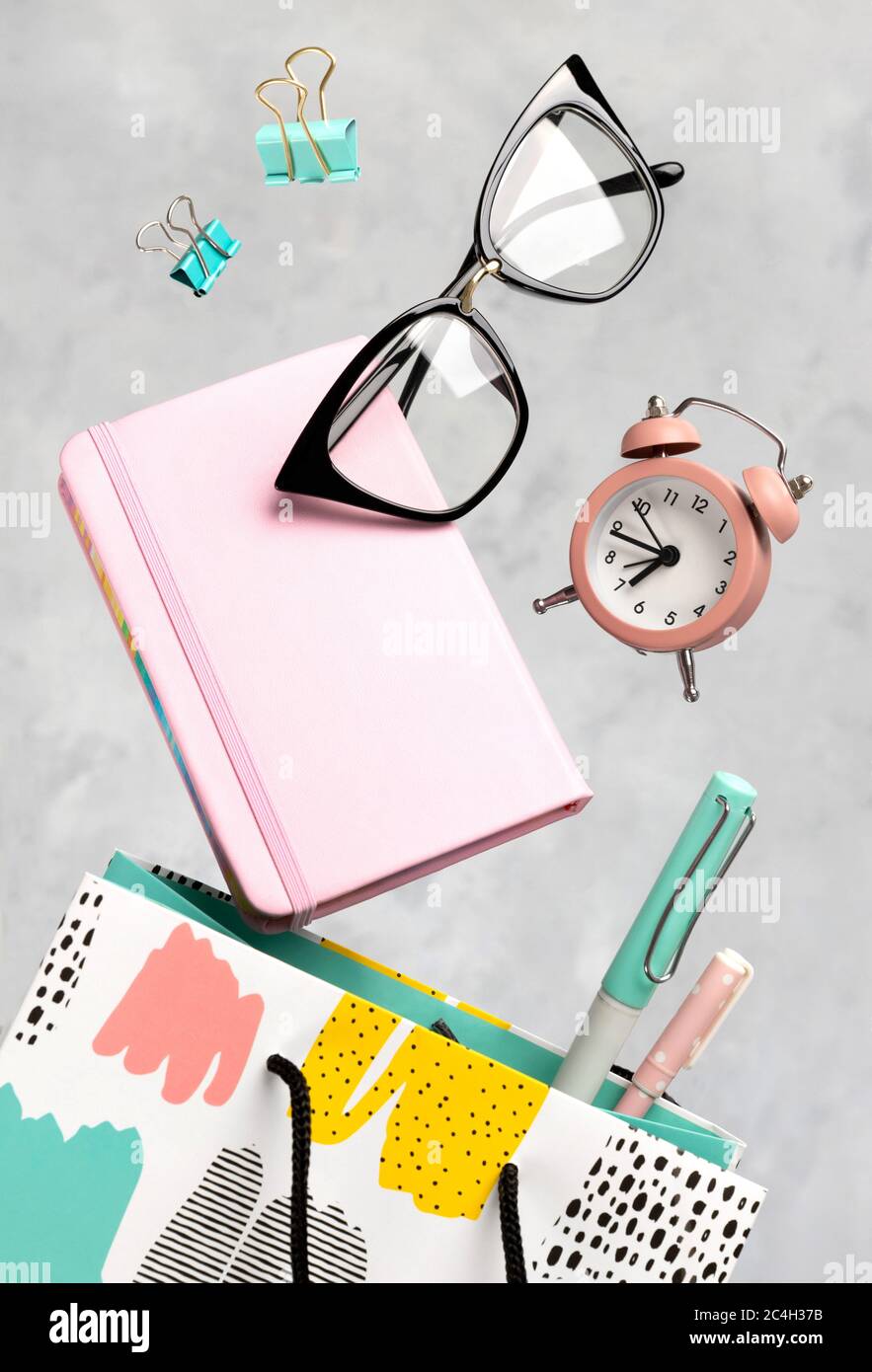 Office supplies stationery levitate over concrete gray background Stock