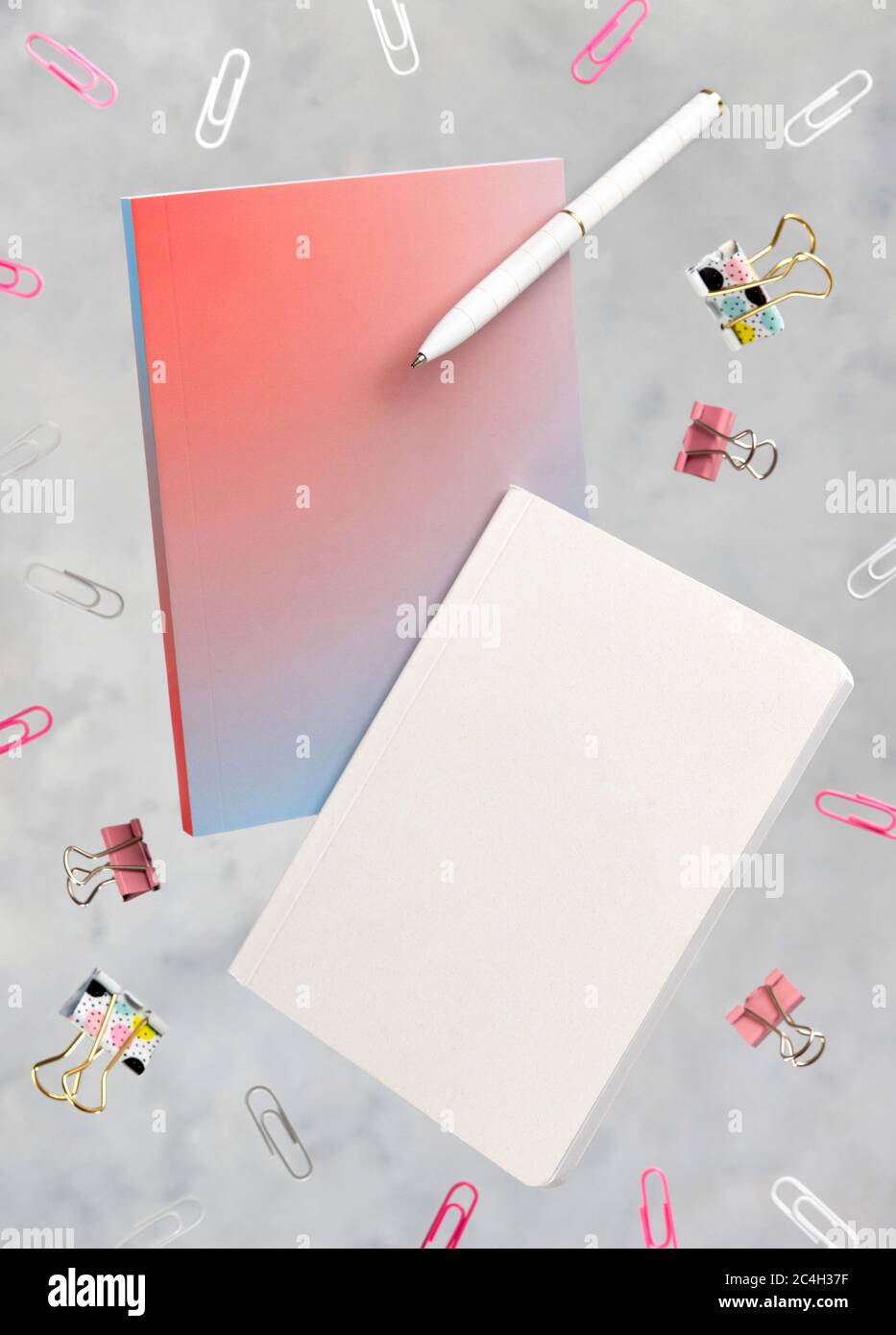 Office supplies stationery levitate over concrete gray background Stock Photo