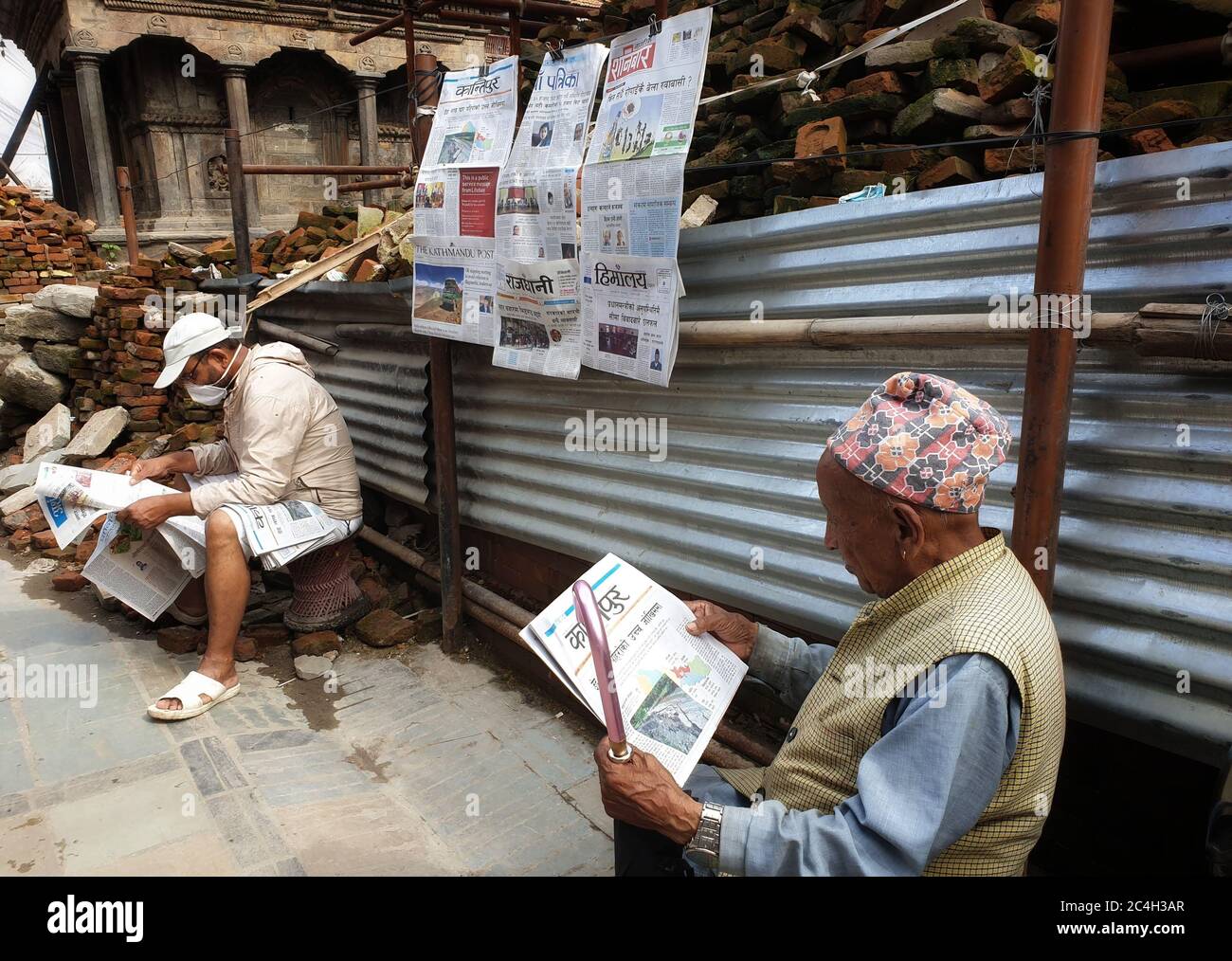Kathmandu, Nepal. 27th June, 2020. Nepali people read newspapers early