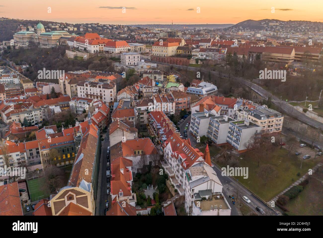 Aerial drone shot of Buda castle on hill during Budapest sunset hour ...