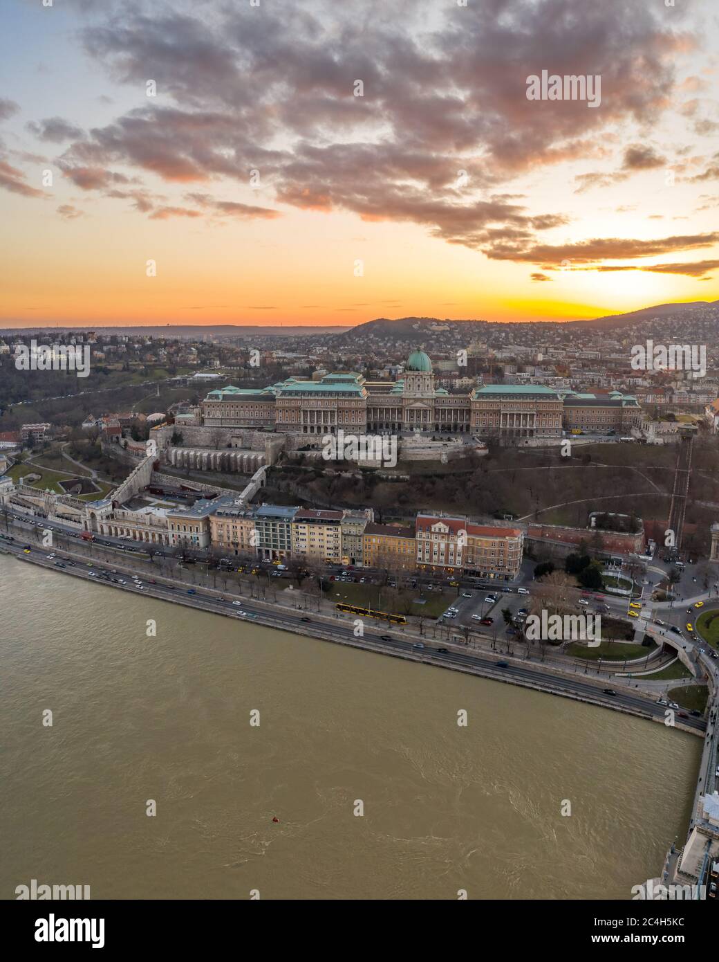 Aerial drone shot of Buda castle on hill during Budapest sunset hour ...