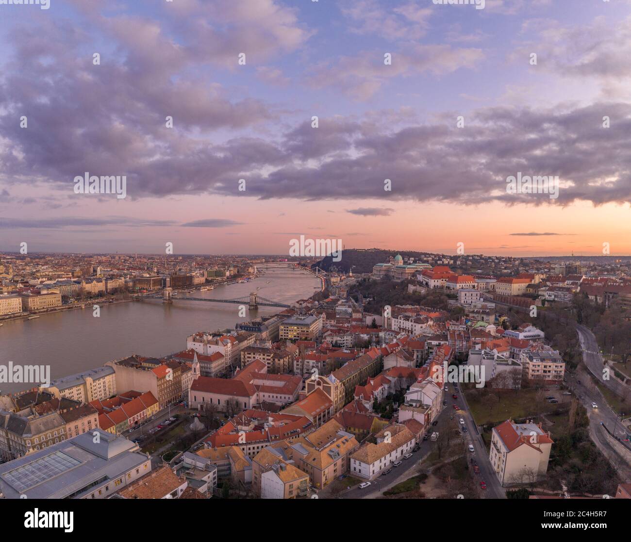 Aerial drone shot of Buda castle on hill during Budapest sunset hour ...