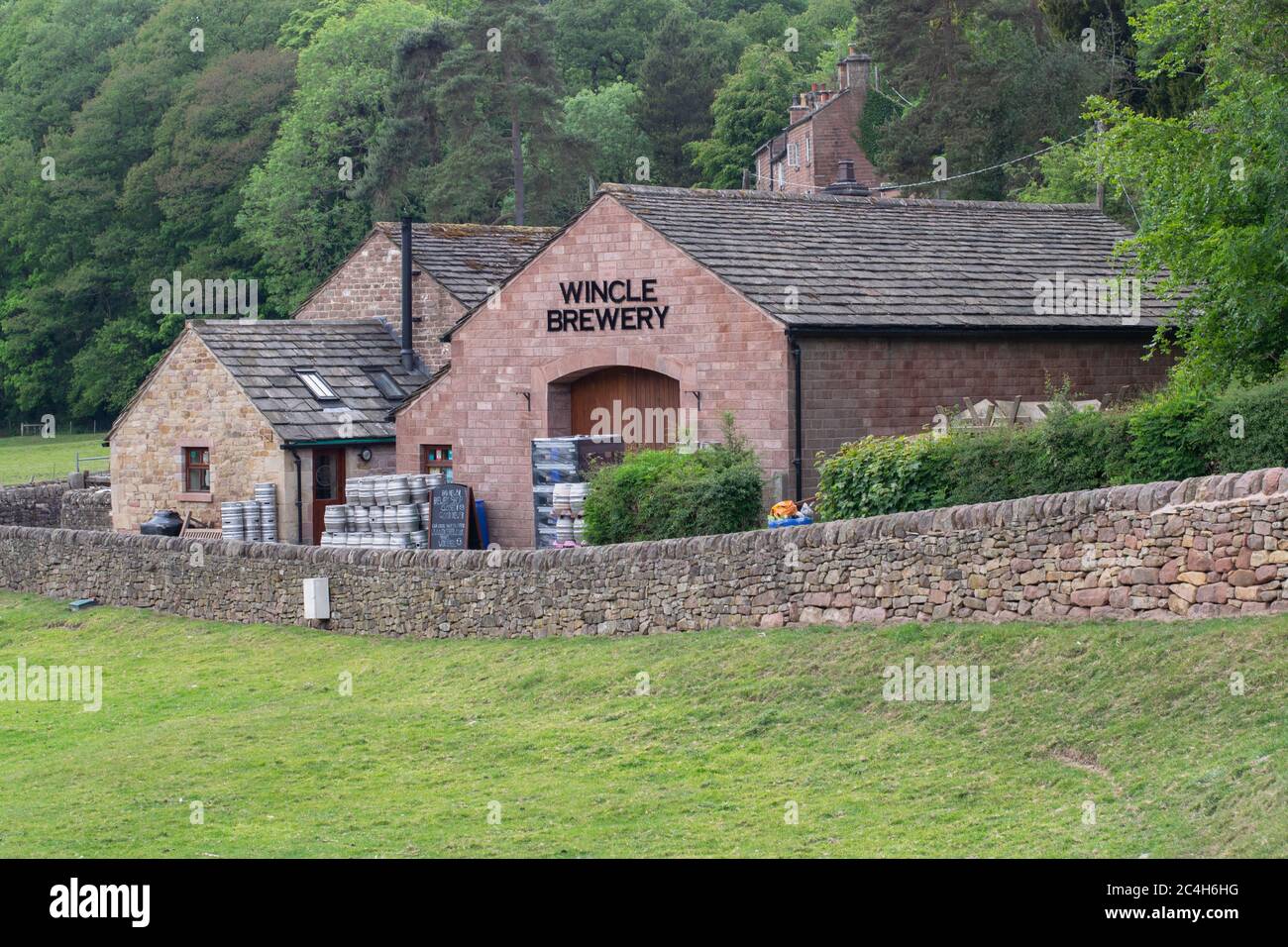 Wincle Brewery with sign, metal cask. Sandstone building with slate roof in Vale Royal Stock Photo