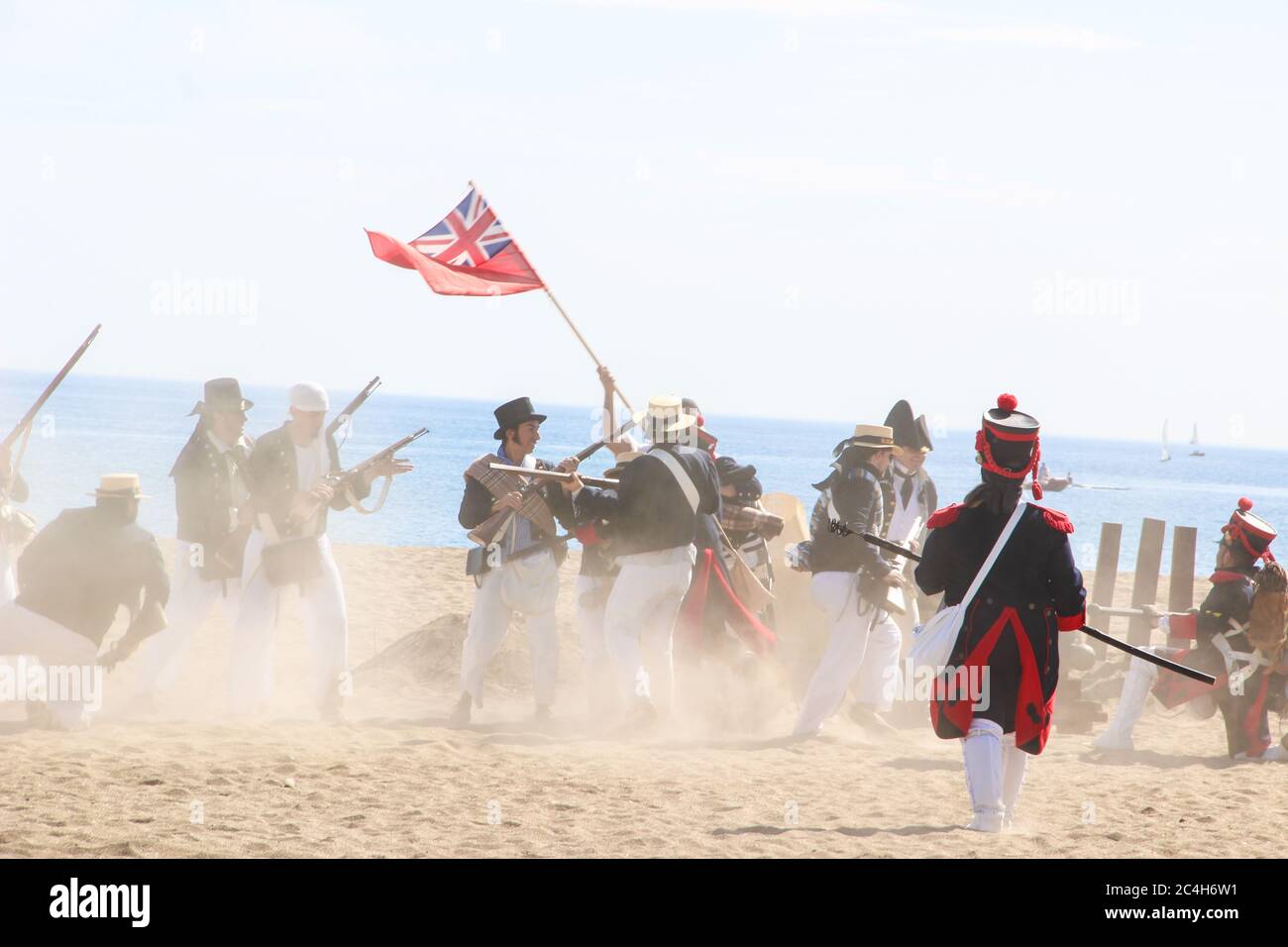 Malaga, Spain - October 26, 2014: 18th century troops of the Royal Navy fight against French soldiers. Historical reenactment of the British landing o Stock Photo