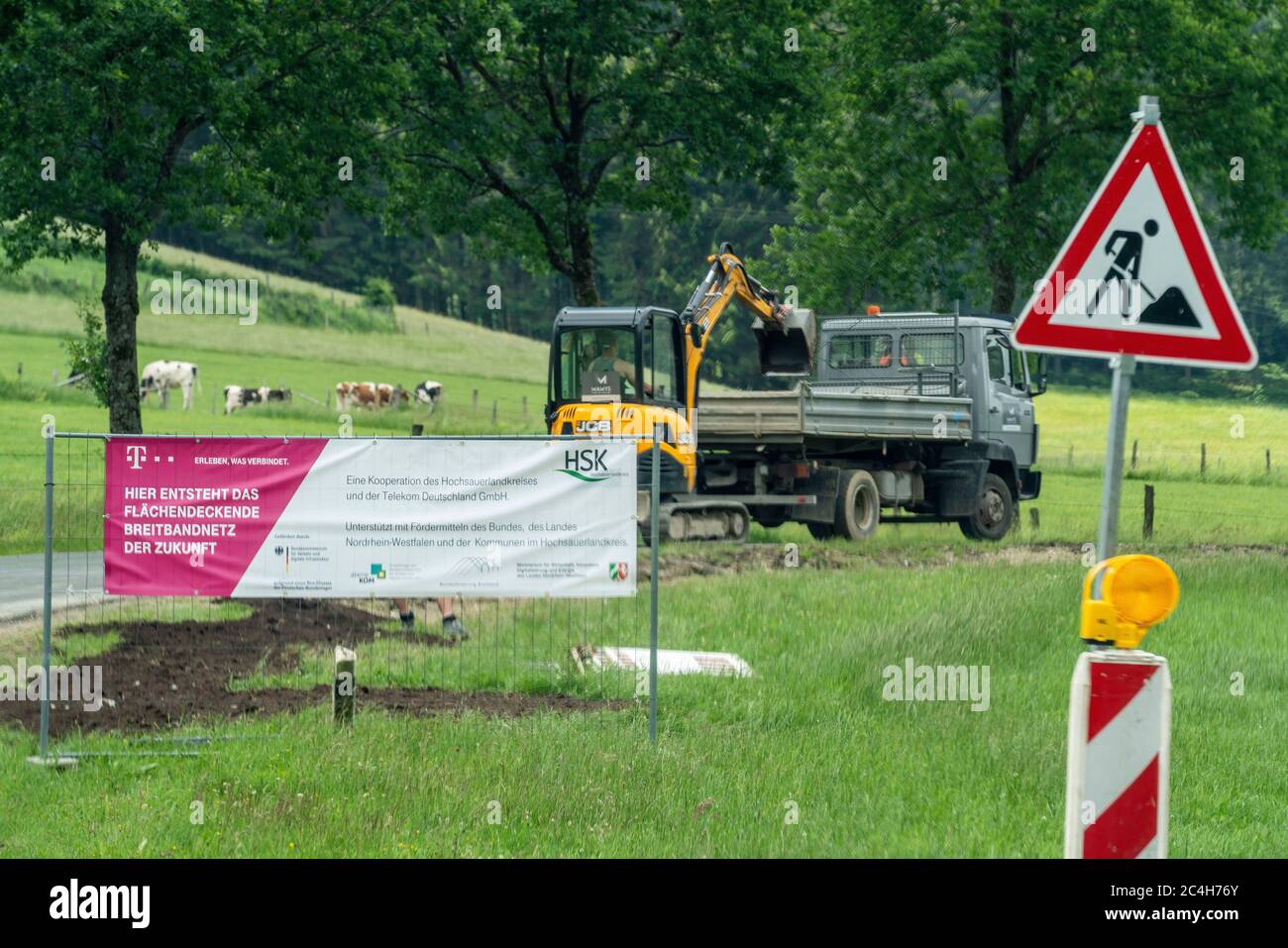 Construction site, laying of modern broadband cable, by Telekom, fast Internet, near Osterwald, a district of the city of Schmallenberg, Hochsauerland Stock Photo