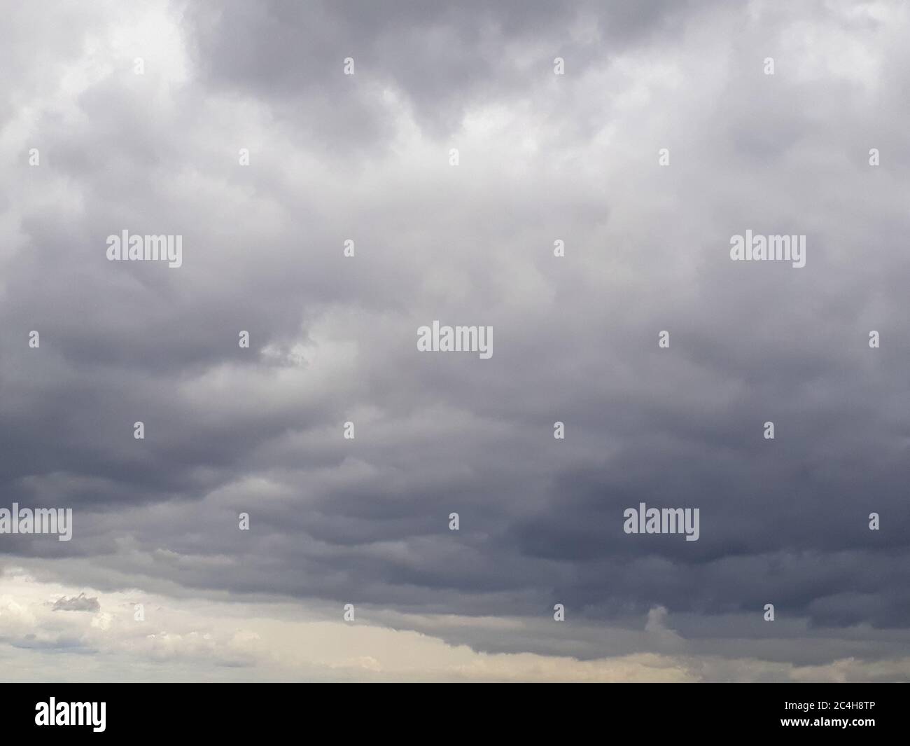 Low gray northern sky with melting clouds. Clouds, atmosphere, bad weather. Cloudy, humid. It's going to rain soon. Stock Photo